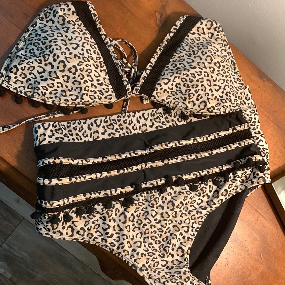 Adorable cheetah print bikini! Never worn. Size large but fits like a medium.